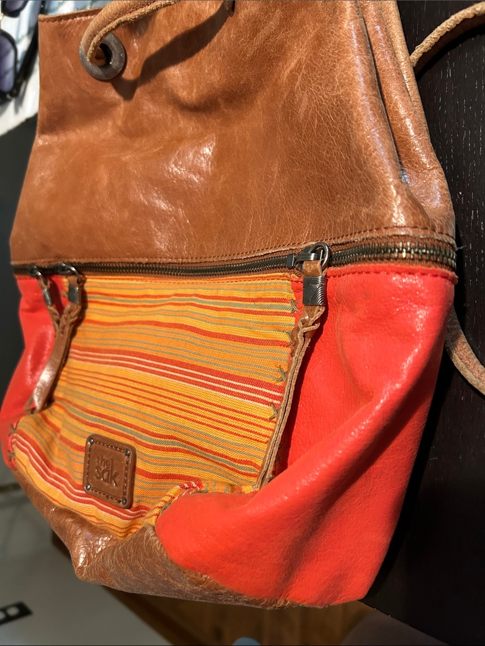 The Sak Brown Leather Drawstring Shoulder Bag with Orange Accents - Picture 4 of 9